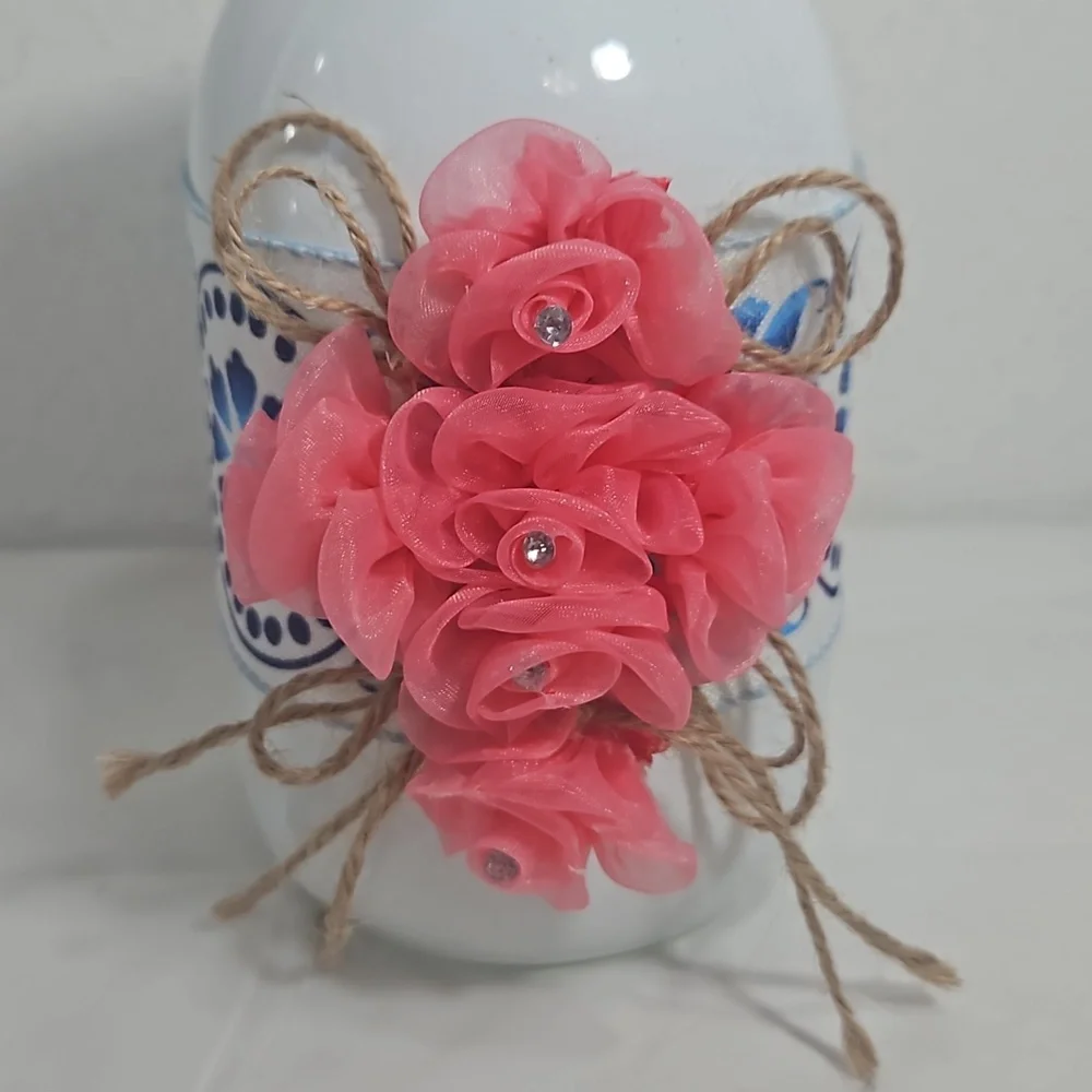 handmade white mason jar with floral blue ribbon and pink flower cross